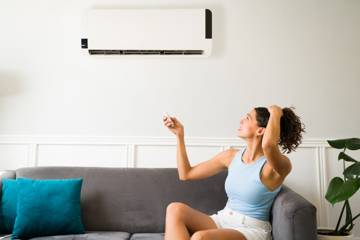 Woman is frustrated with broken AC unit